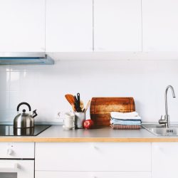 White Kitchen Interior Accessories Dishes Staff Apple Grocery Products Stand on Table Details Small kitchen